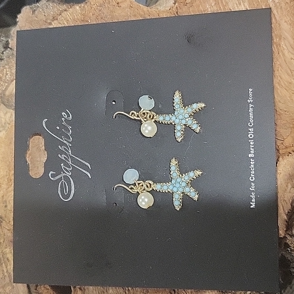 Sapphire blue and gold tone starfish earrings
